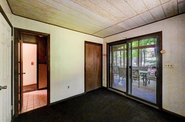 13 Sheffick Rd, Clifton Township, PA 18424 - unfurnished room with wooden ceiling and dark carpet