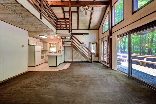 13 Sheffick Rd, Clifton Township, PA 18424 - unfurnished living room featuring light colored carpet, ceiling fan, a towering ceiling, a wooden ceiling with exposed beams, and a baseboard radiator