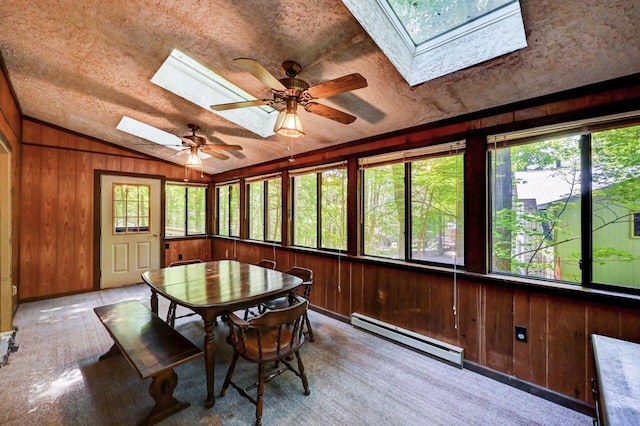 13 Sheffick Rd, Clifton Township, PA 18424 - sunroom with a skylight, baseboard heating, vaulted ceiling, wood walls, and a textured ceiling