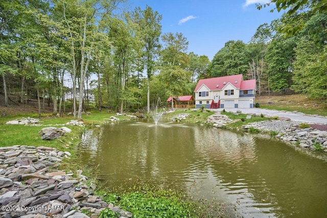 water view featuring a forest view