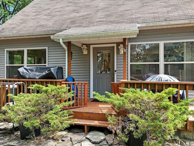 2218 Lancaster Dr, Lehman, PA 18324 - entrance to property featuring a shingled roof and a wooden deck