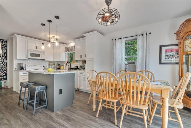 2218 Lancaster Dr, Lehman, PA 18324 - dining space featuring wood finished floors and cooling unit
