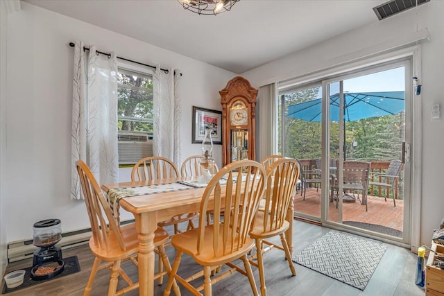 2218 Lancaster Dr, Lehman, PA 18324 - dining room with wood finished floors, healthy amount of natural light, and cooling unit