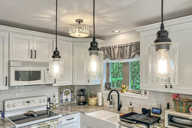 2218 Lancaster Dr, Lehman, PA 18324 - kitchen featuring white appliances, white cabinets, and backsplash