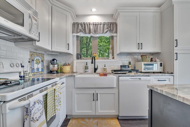2218 Lancaster Dr, Lehman, PA 18324 - kitchen featuring white appliances, white cabinetry, recessed lighting, backsplash, and light stone countertops