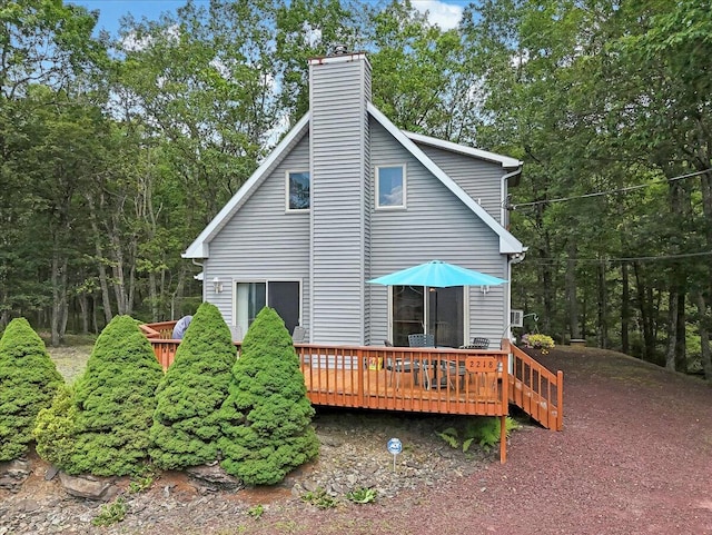 2218 Lancaster Dr, Lehman, PA 18324 - back of property with a wooden deck and a chimney