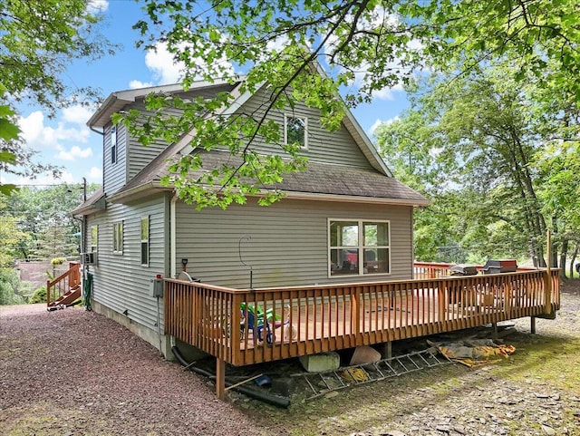 2218 Lancaster Dr, Lehman, PA 18324 - rear view of house with a wooden deck and roof with shingles