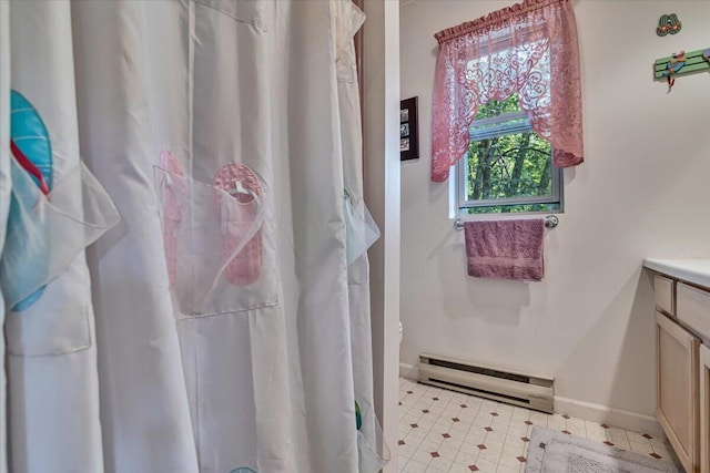 2218 Lancaster Dr, Lehman, PA 18324 - full bathroom featuring a baseboard radiator, vanity, curtained shower, and tile patterned floors