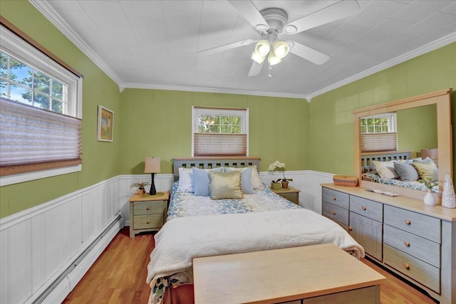 95 Franklin Heights Rd, Lehighton, PA 18235 - bedroom featuring a baseboard radiator, multiple windows, light wood-style flooring, ornamental molding, and wainscoting