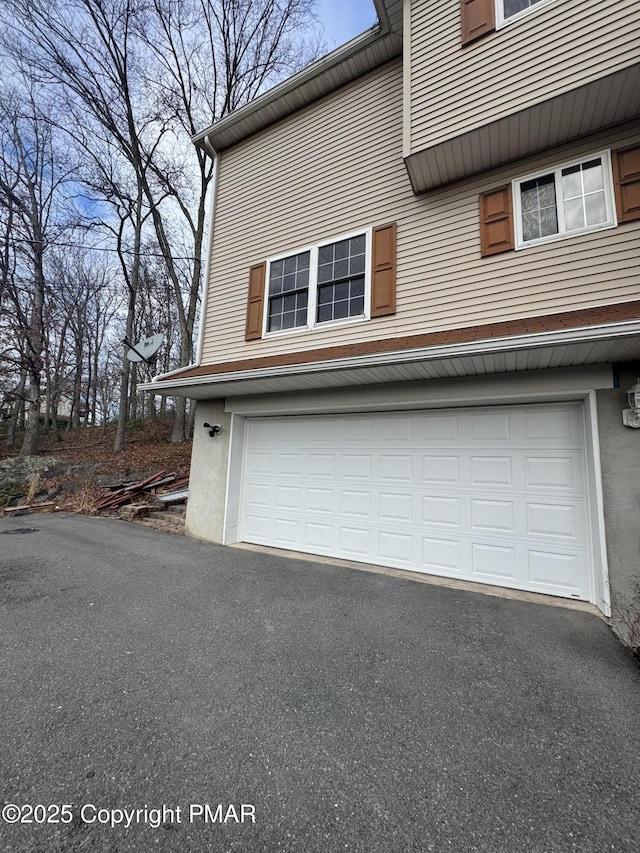 garage featuring driveway