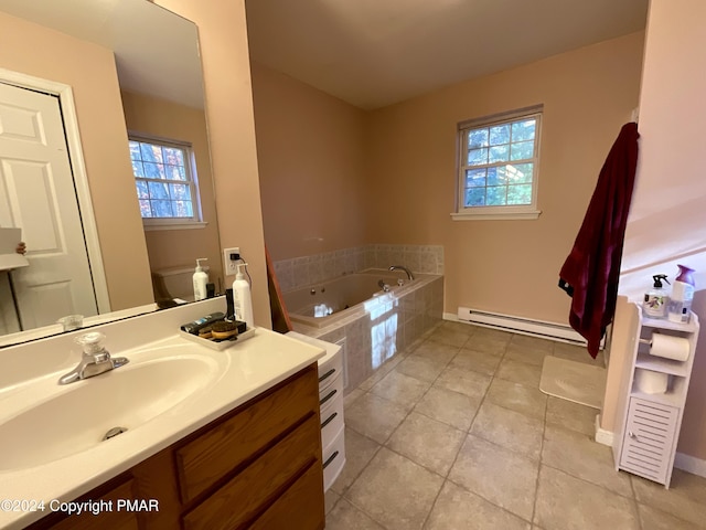 bathroom featuring a bath, a baseboard radiator, vanity, and a wealth of natural light