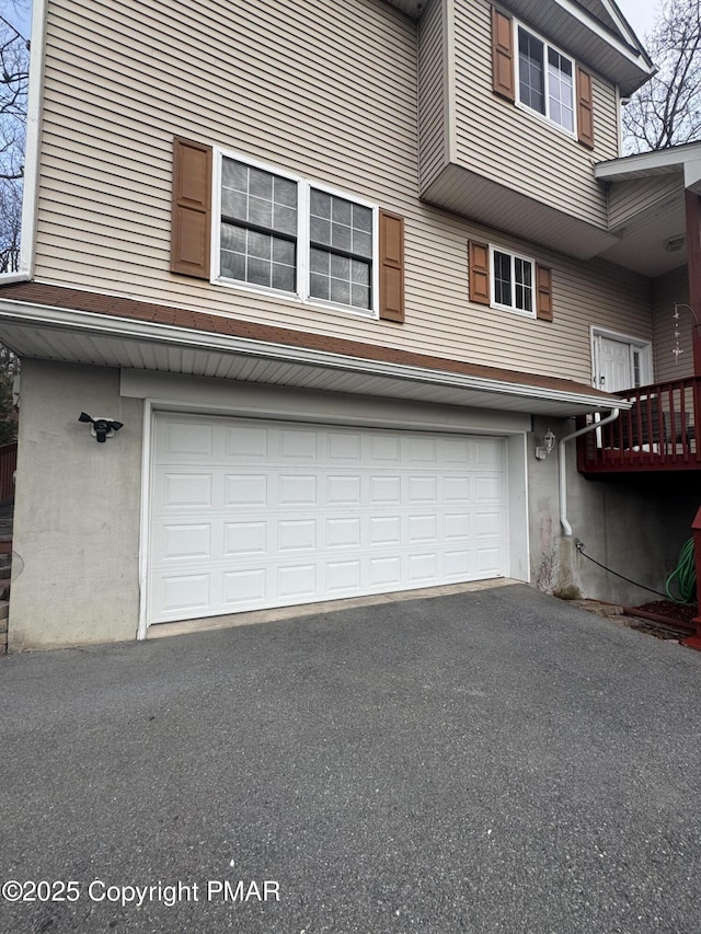 garage featuring driveway