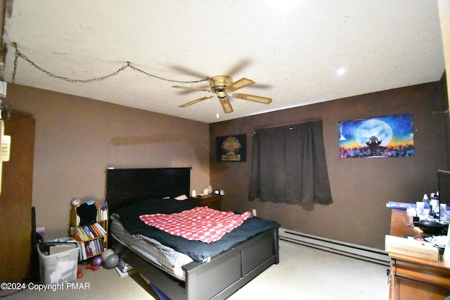 bedroom with a baseboard heating unit and ceiling fan