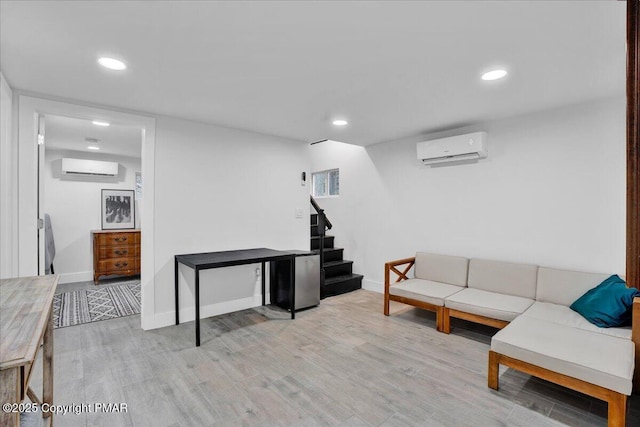 9871 Deerwood Dr, Tobyhanna, PA 18466 - living room with a wall mounted AC, stairs, wood finished floors, baseboards, and recessed lighting