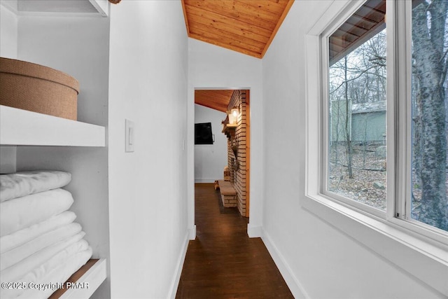 9871 Deerwood Dr, Tobyhanna, PA 18466 - hall featuring healthy amount of natural light, wooden ceiling, vaulted ceiling, dark wood-style flooring, and baseboards