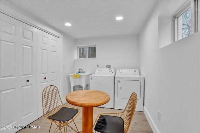 9871 Deerwood Dr, Tobyhanna, PA 18466 - laundry room with separate washer and dryer, light wood-style floors, plenty of natural light, and recessed lighting
