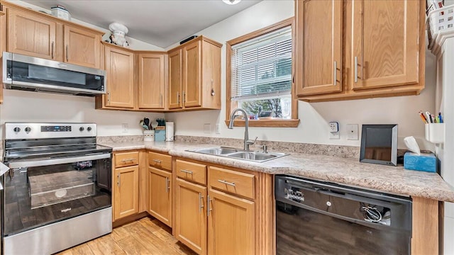 3954 Cedar Dr, Walnutport, PA 18088 - kitchen featuring stainless steel appliances, light countertops, light wood finished floors, and light brown cabinetry