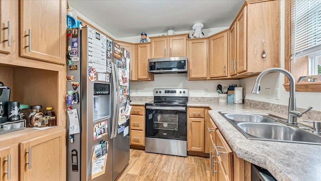 3954 Cedar Dr, Walnutport, PA 18088 - kitchen featuring appliances with stainless steel finishes, light countertops, light wood-style flooring, and light brown cabinetry