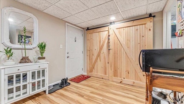 3954 Cedar Dr, Walnutport, PA 18088 - foyer entrance with a barn door, wood finished floors, a drop ceiling, and recessed lighting