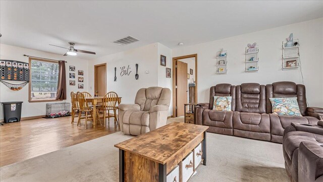 3954 Cedar Dr, Walnutport, PA 18088 - living room featuring a ceiling fan, light colored carpet, and light wood-style floors