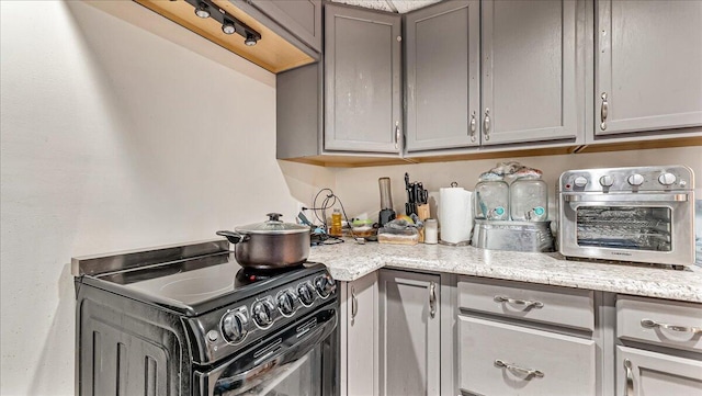 3954 Cedar Dr, Walnutport, PA 18088 - kitchen featuring black / electric stove, gray cabinets, and light stone countertops