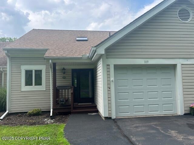 109 Duck Hollow Cir, Stroudsburg, PA 18360 - view of front of house featuring driveway, a shingled roof, and a garage