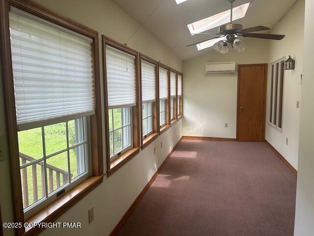 109 Duck Hollow Cir, Stroudsburg, PA 18360 - unfurnished sunroom featuring vaulted ceiling, a skylight, and a wall mounted air conditioner