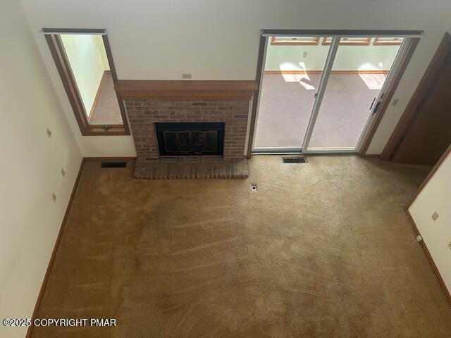 109 Duck Hollow Cir, Stroudsburg, PA 18360 - unfurnished living room featuring carpet flooring and a fireplace
