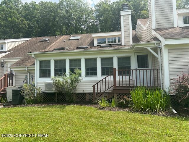 109 Duck Hollow Cir, Stroudsburg, PA 18360 - back of house featuring a lawn, a chimney, and roof with shingles
