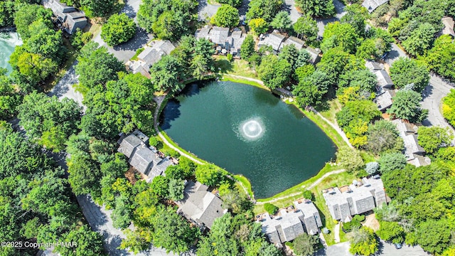 drone / aerial view with a water view and a residential view