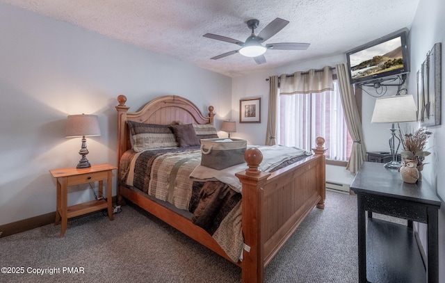 bedroom with a ceiling fan, baseboards, a baseboard heating unit, and a textured ceiling