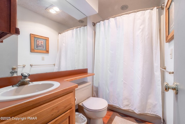 full bathroom with vanity and toilet