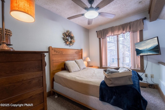 bedroom with carpet floors, vaulted ceiling with beams, a textured ceiling, and a ceiling fan