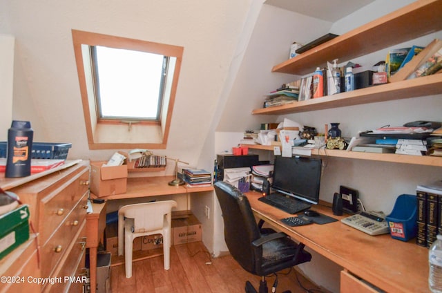 office featuring light wood-style flooring and built in study area