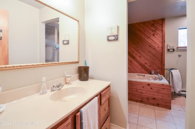 full bath featuring tile patterned floors, a garden tub, wood walls, and vanity