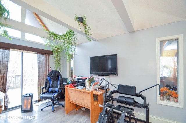 office space featuring lofted ceiling with beams and wood finished floors