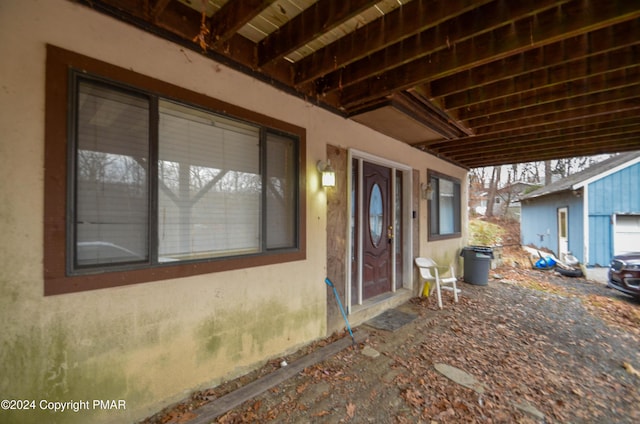 doorway to property with stucco siding