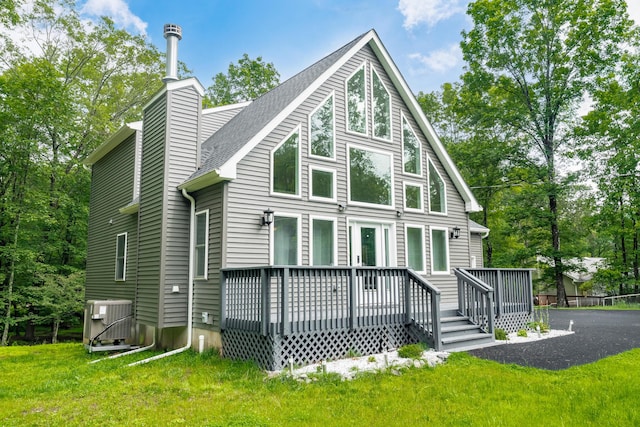 4130 Mill Creek Dr, Cresco, PA 18326 - back of property with a deck, a chimney, a yard, and roof with shingles