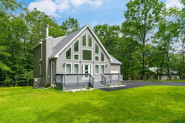 4130 Mill Creek Dr, Cresco, PA 18326 - chalet / cabin with a wooden deck, a front yard, and roof with shingles