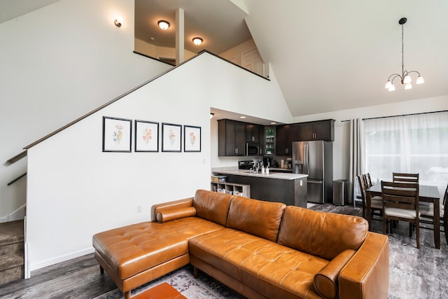 4130 Mill Creek Dr, Cresco, PA 18326 - living room featuring a chandelier, high vaulted ceiling, wood finished floors, and stairs