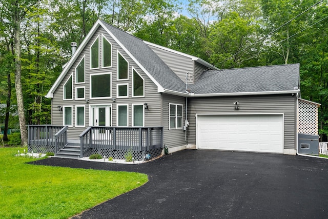 4130 Mill Creek Dr, Cresco, PA 18326 - rustic home with driveway, a shingled roof, a garage, a deck, and a front yard