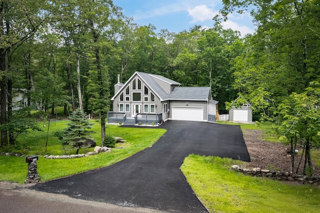 4130 Mill Creek Dr, Cresco, PA 18326 - view of front of home featuring a garage, a chimney, asphalt driveway, and a view of trees