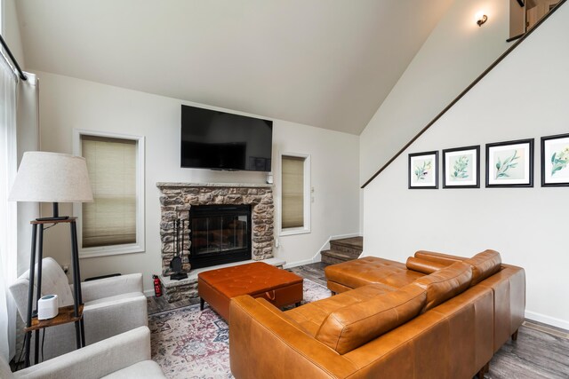 4130 Mill Creek Dr, Cresco, PA 18326 - living room featuring wood finished floors, a fireplace, stairway, and lofted ceiling