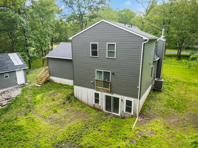 4130 Mill Creek Dr, Cresco, PA 18326 - rear view of property with a yard, a storage shed, and roof with shingles