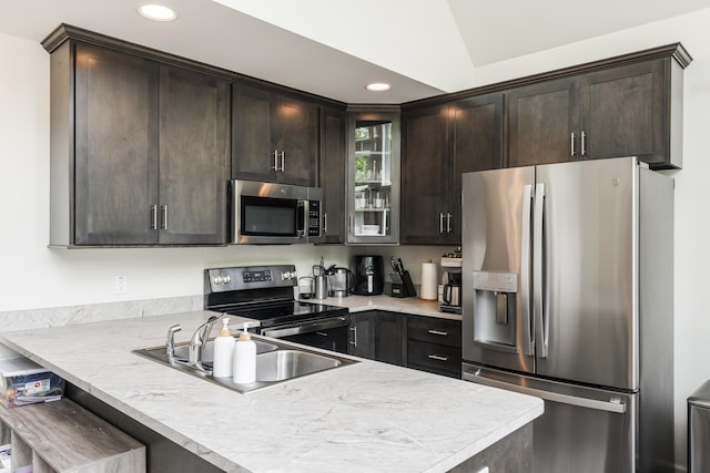 4130 Mill Creek Dr, Cresco, PA 18326 - kitchen with stainless steel appliances, dark brown cabinets, a peninsula, glass insert cabinets, and light countertops