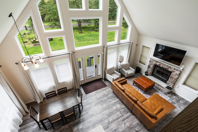 4130 Mill Creek Dr, Cresco, PA 18326 - living area featuring high vaulted ceiling, wood finished floors, and a stone fireplace