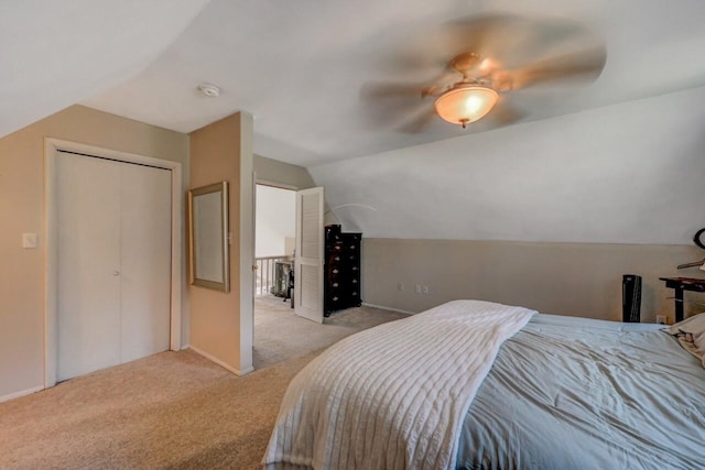 carpeted bedroom with baseboards, ceiling fan, and vaulted ceiling
