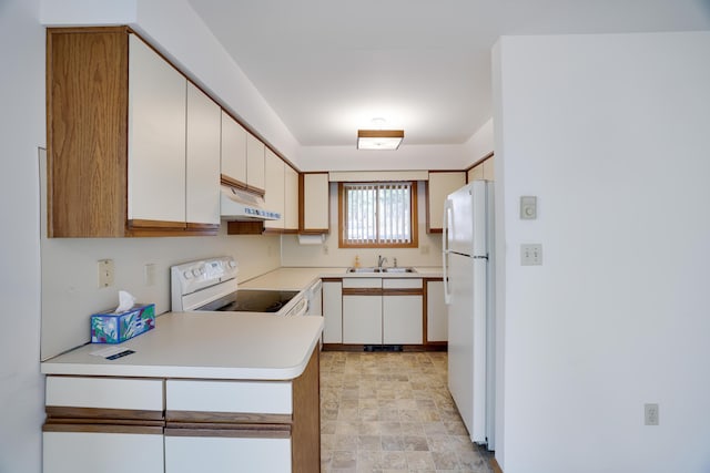476 Hyland Dr, East Stroudsburg, PA 18301 - kitchen featuring white appliances, light countertops, under cabinet range hood, white cabinets, and a sink