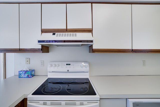 476 Hyland Dr, East Stroudsburg, PA 18301 - kitchen with light countertops, range hood, white range with electric cooktop, and white cabinetry