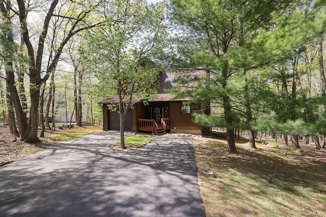 476 Hyland Dr, East Stroudsburg, PA 18301 - chalet / cabin featuring a shingled roof and driveway